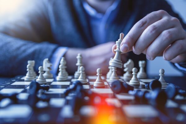Strategy Pattern,PHP 策略模式 depth of field photography of man playing chess